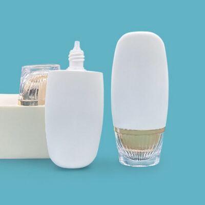 50ml Oval Shaped Luxury Gold Sunscreen Bottle - High-End Cosmetic Plastic Bottle for Skincare